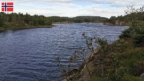 Blick vom besser zum Angeln geeigneten Ostufer über den Flatebøvatnet bei Ramsland bei gutem Wetter